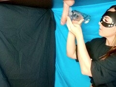 Man reaches climax on milking table, filling a glass with his cum