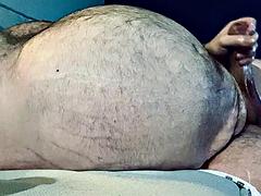 FAT DADDY STROKING HIS THICK UNCUT COCK ON THE COUCH