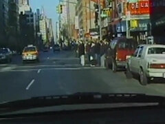 Watch this stunning redhead with gorgeous breasts get naughty in a vintage car during traffic