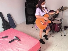 College girl makes a hot video in her study room while playing classical guitar