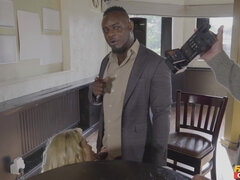 Busty Blonde Karlie Simon gives a blowjob to two men at a pub