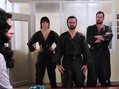 Brunette is face-fucked by two guys while a horny girl fingerbangs her