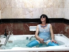 Crossdresser showcases lingerie and enjoys a sissy shower in pantyhose