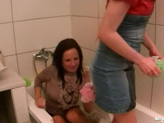 Beauties In The Tub In Fully Clothed Scrub-Down