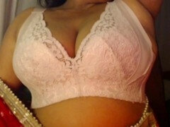 Desi hottie Hotgirl21 has fun showing off her sexy milk jugs in a cute white bra