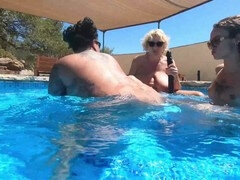 Super steamy lesbian fun with a double-ended dildo in the pool