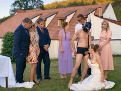 A man in a dog mask is fucking the bride while outside
