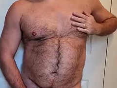 Hairy man takes off his shirt and blows his load