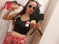 Sexy brunette in the fitting room shows off her woolly pussy and big nipples