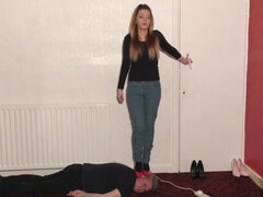 High-Heeled Babe Dances and Tramples Slave's Head Fetish