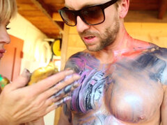 MILF Kelly Madison in paint gives blowjob