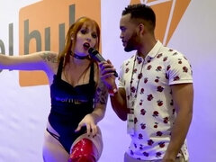 Mel Fire interview at AVN porn show - pole dance @ pornhub booth