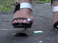 Outside roach crushing in high heels.