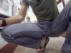 Hunky muscle guy Lapetus gets off in the mall while soaking his jeans