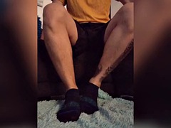 He plays with his socks after playing soccer