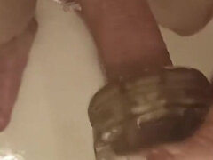 The Guy Washes in the Shower and Plays with a Toy Masturbator, Gets Pleasure