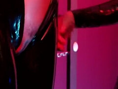 Slave Girl in Latex Catsuit in Electro-shock-heels