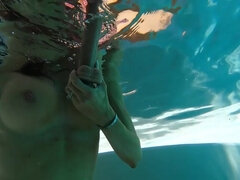 Diving in the pool and playing with a big dildo in HD