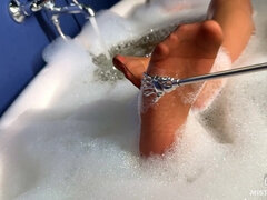 Scratching Mistress's Nylon Feet with a Scratcher in a Foam Bath