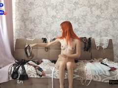 Red-haired girl in a dress teases with a sex toy and dirty talk joi