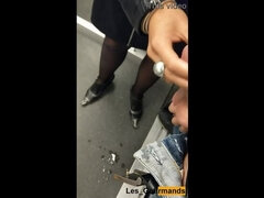 Very sexy MILF in a stocking leather skirt and heels wanks her husband's cock and makes it cum twice in his thong! in a public elevator