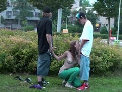 A gorgeous y. blonde girl is fucked in public by 2 guys on the street with a blowjob sucking dicks and vaginal pussy sex penetration with all the cars