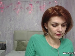 Ginger MILF in red dress on webcam live show