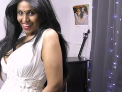 Indian woman with a nice smile is dancing and showing off