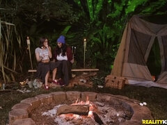 Exotic MILF with big boobs fucks young brunette in a tent