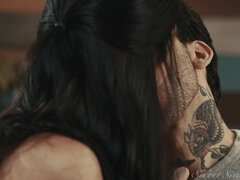 Black-haired MILF pleasuring tattooed dude on the couch