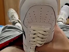 Fucking in sneakers in bed