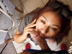 Naughty wife gives a sloppy blowjob while talking to her husband on the phone