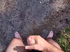 Cumming completely naked in an open parking lot