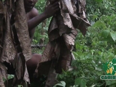 Watch this MILF get pounded hard in a rainforest fuck with her juicy ebony ass and huge tits