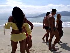 Double penetration session on public beach