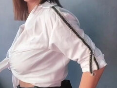 A Brunette in a White Shirt Is Ready to Bare Her Big Breasts