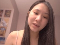 Asian girls engaging in intimate pillow talk