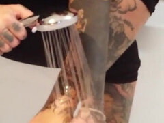 Tattooed blonde MILF washes her feet