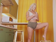 Busty mature Shakkira masturbates in the kitchen