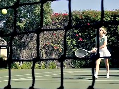 Blonde with big boobs Casey Collins poses on the tennis court in amazing clothes