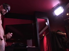 Sportswoman in a mask with an athletic body and tattoos jerks off a cock