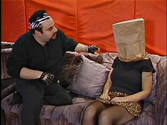 Chubby whore with a paper bag on her head gets her jugs and pussy licked