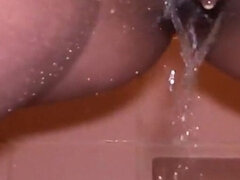 MILF with Pierced Pussy and Big Lips Pissing in Close-up in Her Shower