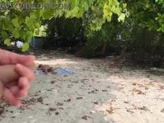 Exhibitionist wanks over busty MILF and her stepdaughter, leaving them with cum-covered faces under the sun
