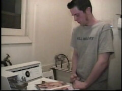 Boy-next-door spreads his new straight porn magazine on top of the washing machine and pulls his cock out of the fly.