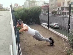 Muscular guy works out and meets with a street agent