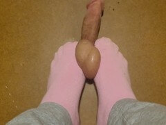 Cute feet in pink socks trampling and getting rock hard treatment