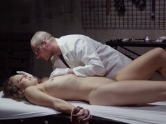 Tied brunette is getting examined by the horrible doctor