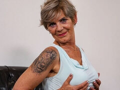 Cute short-haired blonde Claire Benz opens her shaved pussy