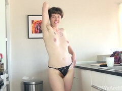 Roxanne has fun stripping naked in her kitchen